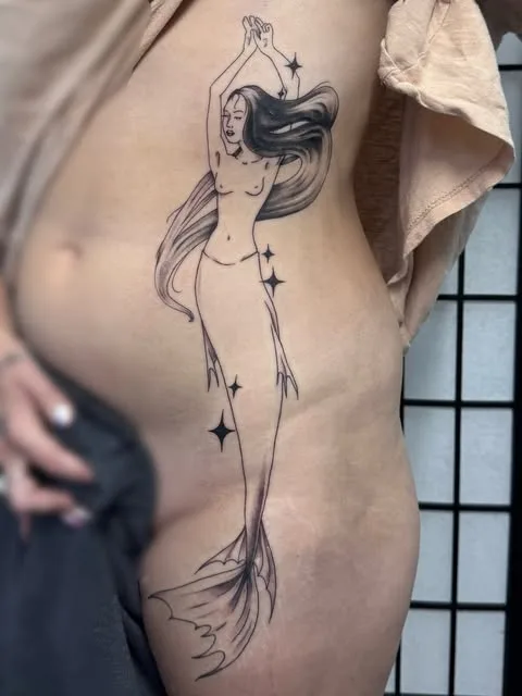 Fine line mermaid cover-up tattoo